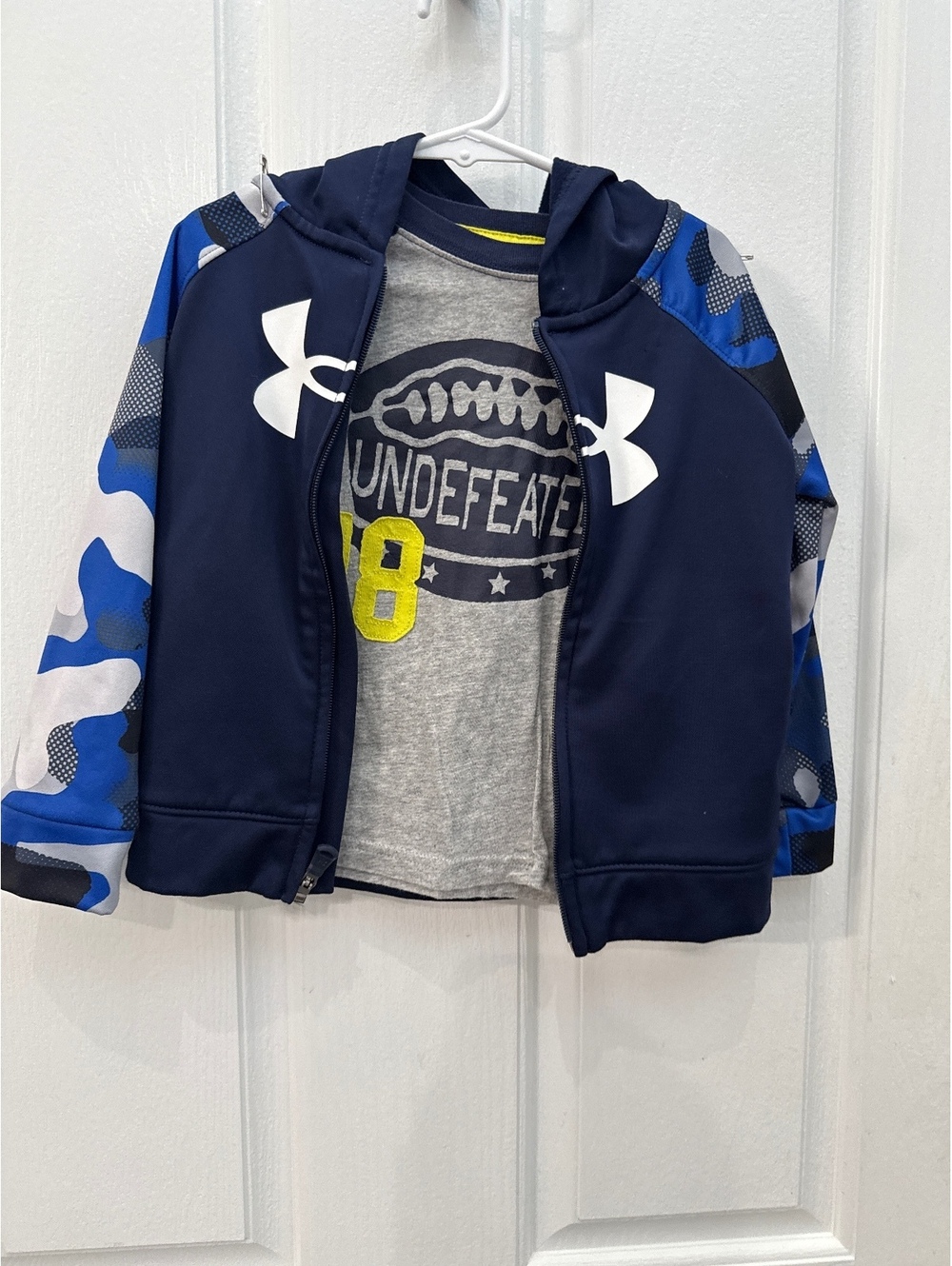 2 shirts, 1 long sleeve, 1 zip up under armour